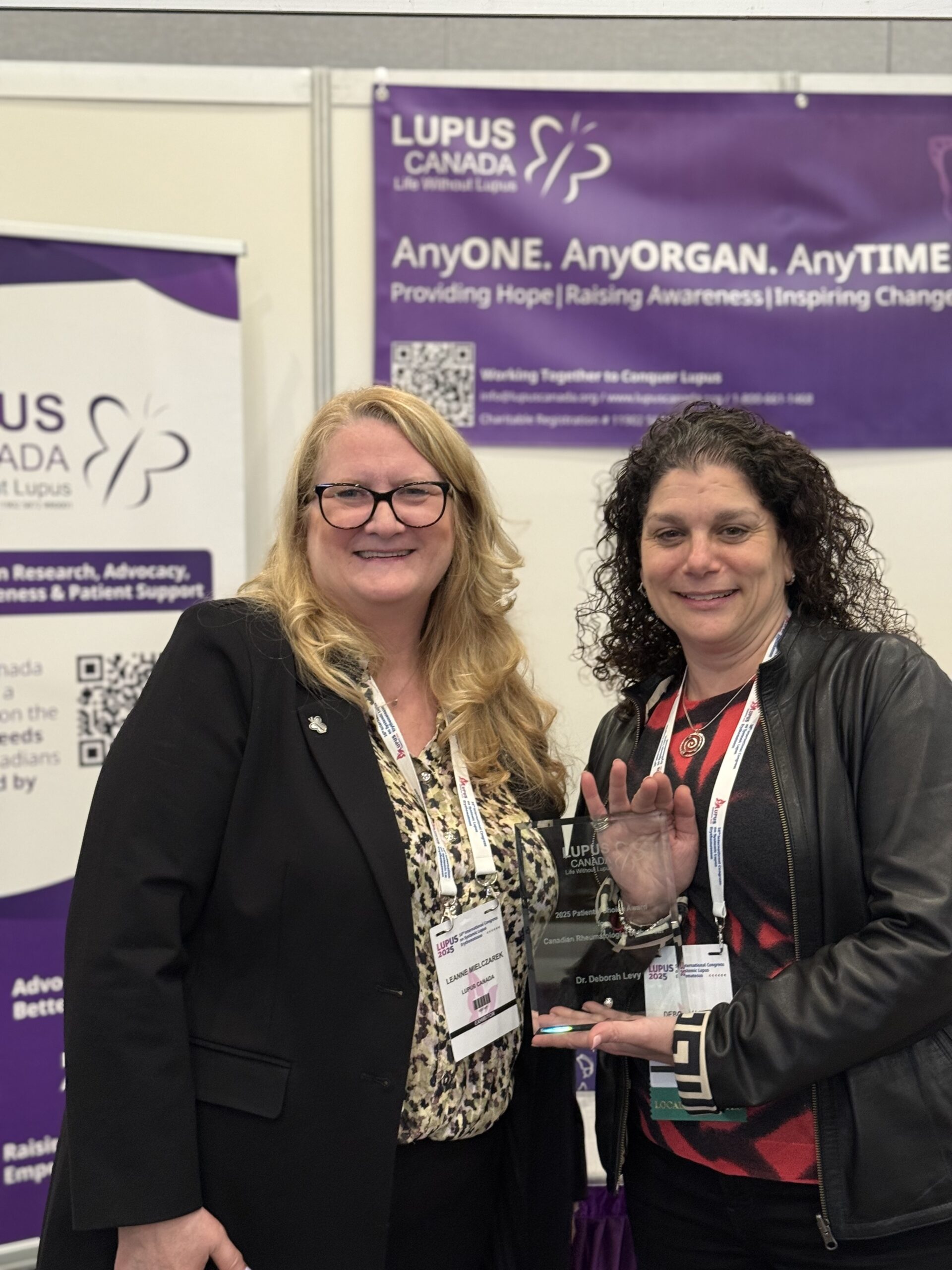 Dr. Deborah Levy and Leanne Mielczarek pose with the Patients’ Choice Award at the Lupus Canada booth.
