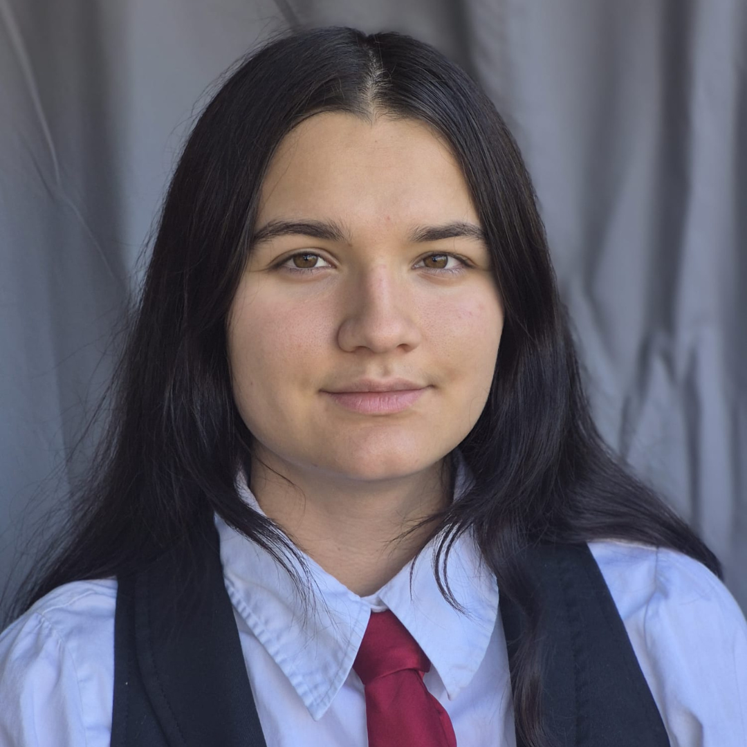 Headshot of Angelina, Lupus Canada Scholarship Winner, wearing a red tie and black vest.