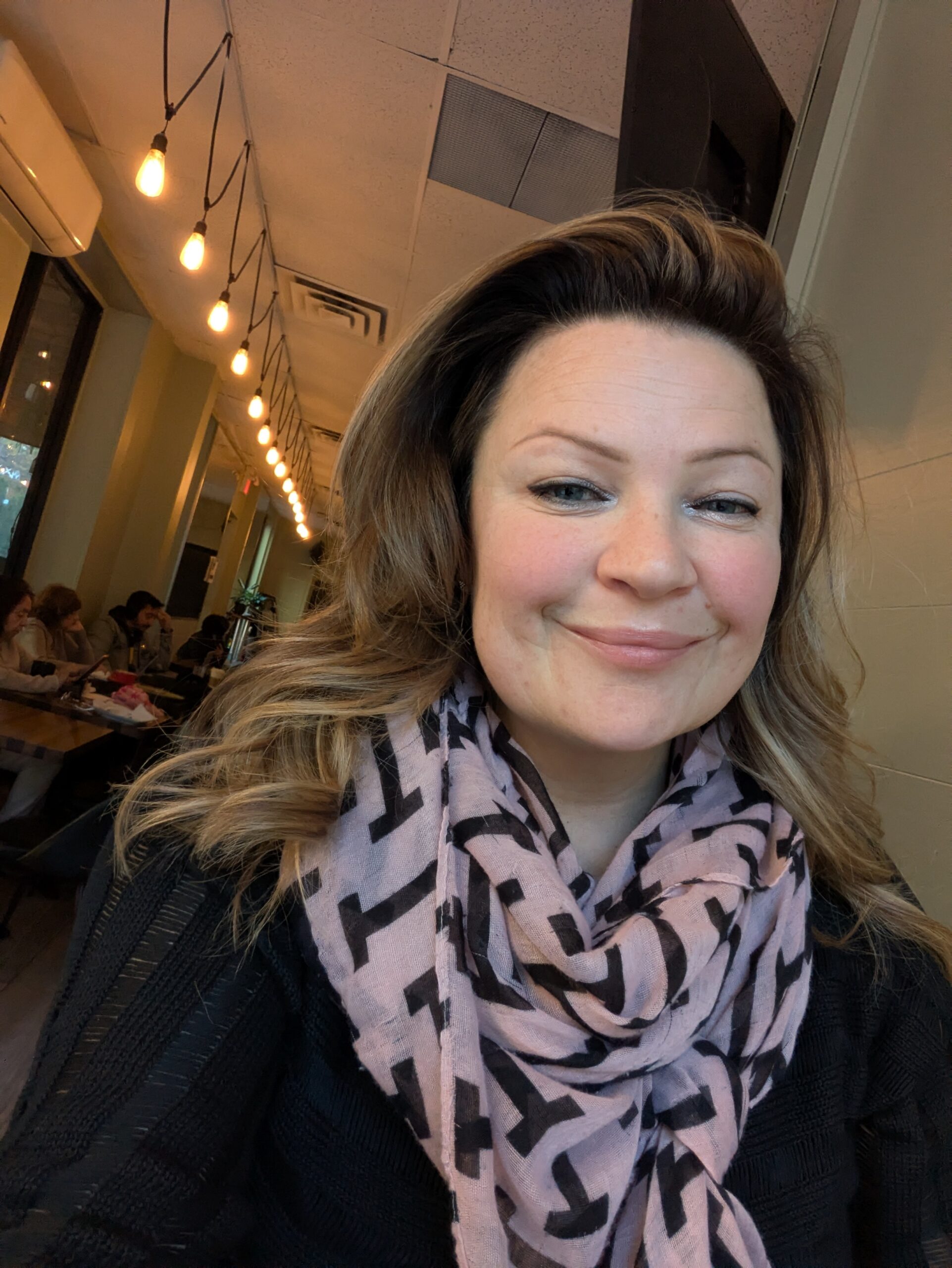 Portrait of Magdalena Sobczak, living with lupus, smiling indoors and sharing her personal journey