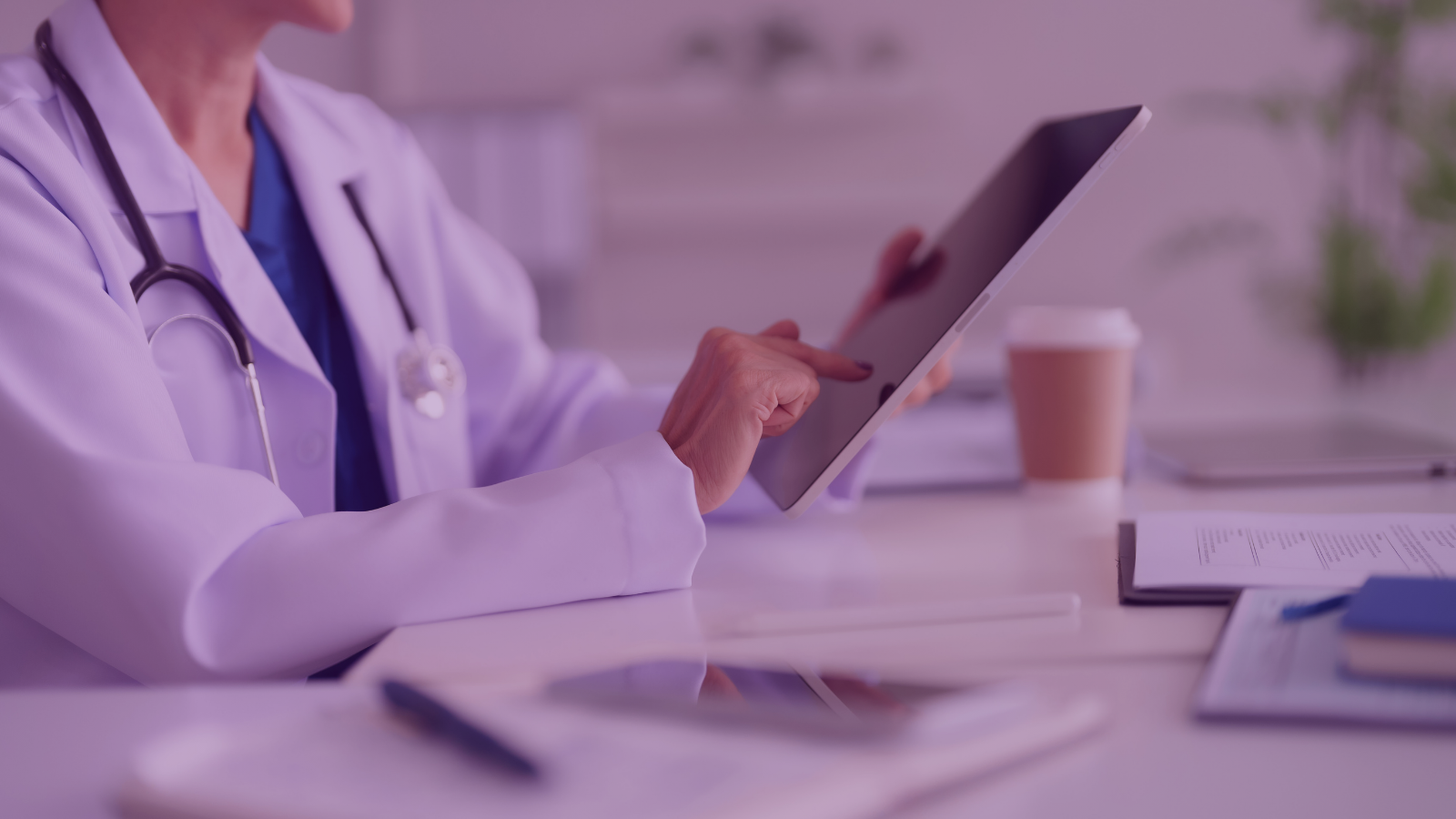 Healthcare professional reviewing research on patient perspectives on lupus clinical trials using a tablet