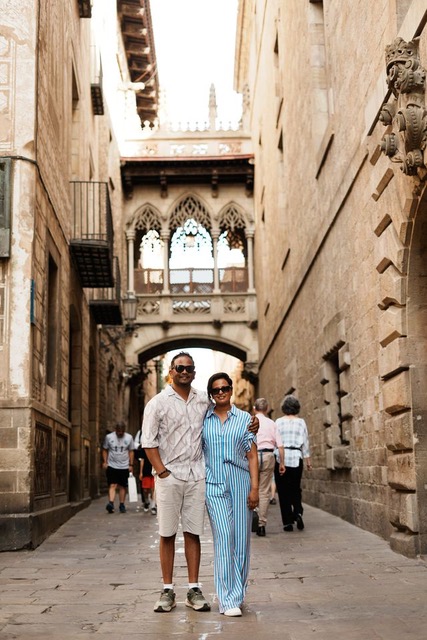 Gabrielle walking with a companion while traveling, reflecting her second chance at life living with lupus