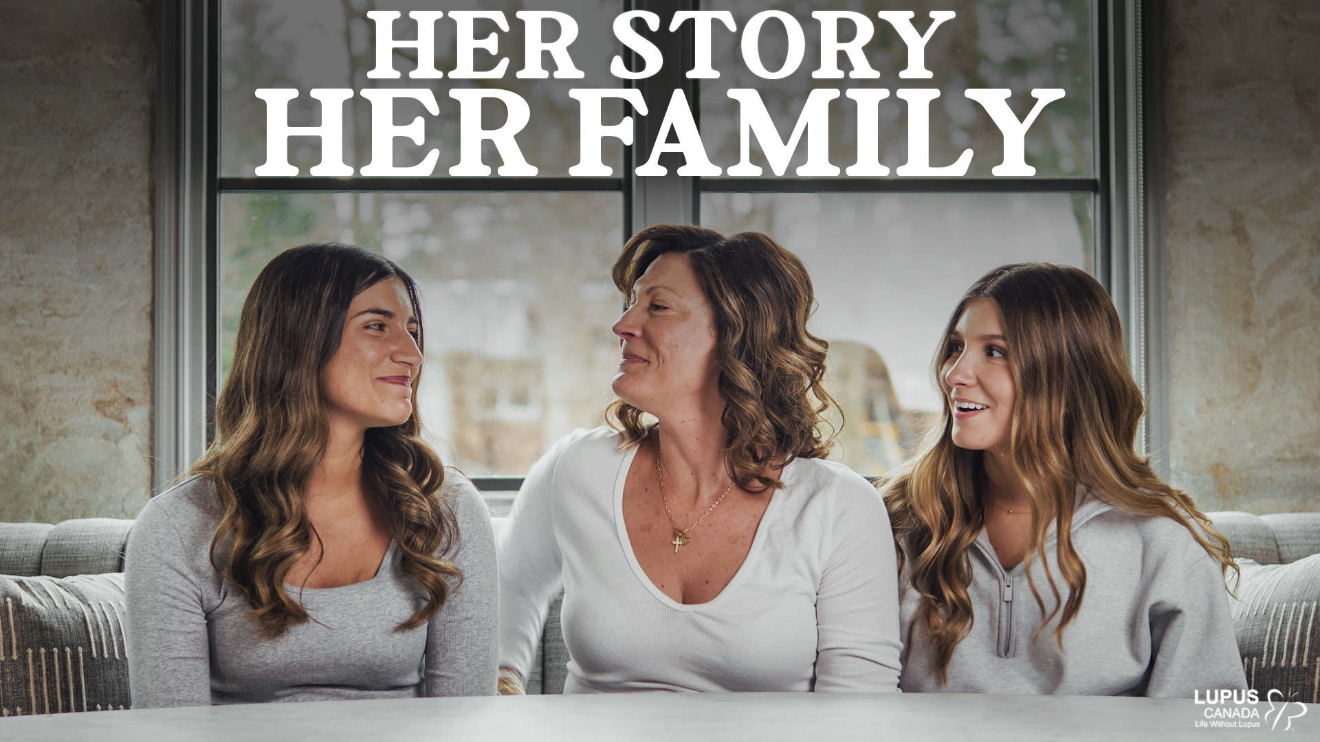 Diana Bozzo embraces one of her daughters in a Lupus Canada video about lupus and motherhood, with the text “Miracle Mom” displayed on the thumbnail.