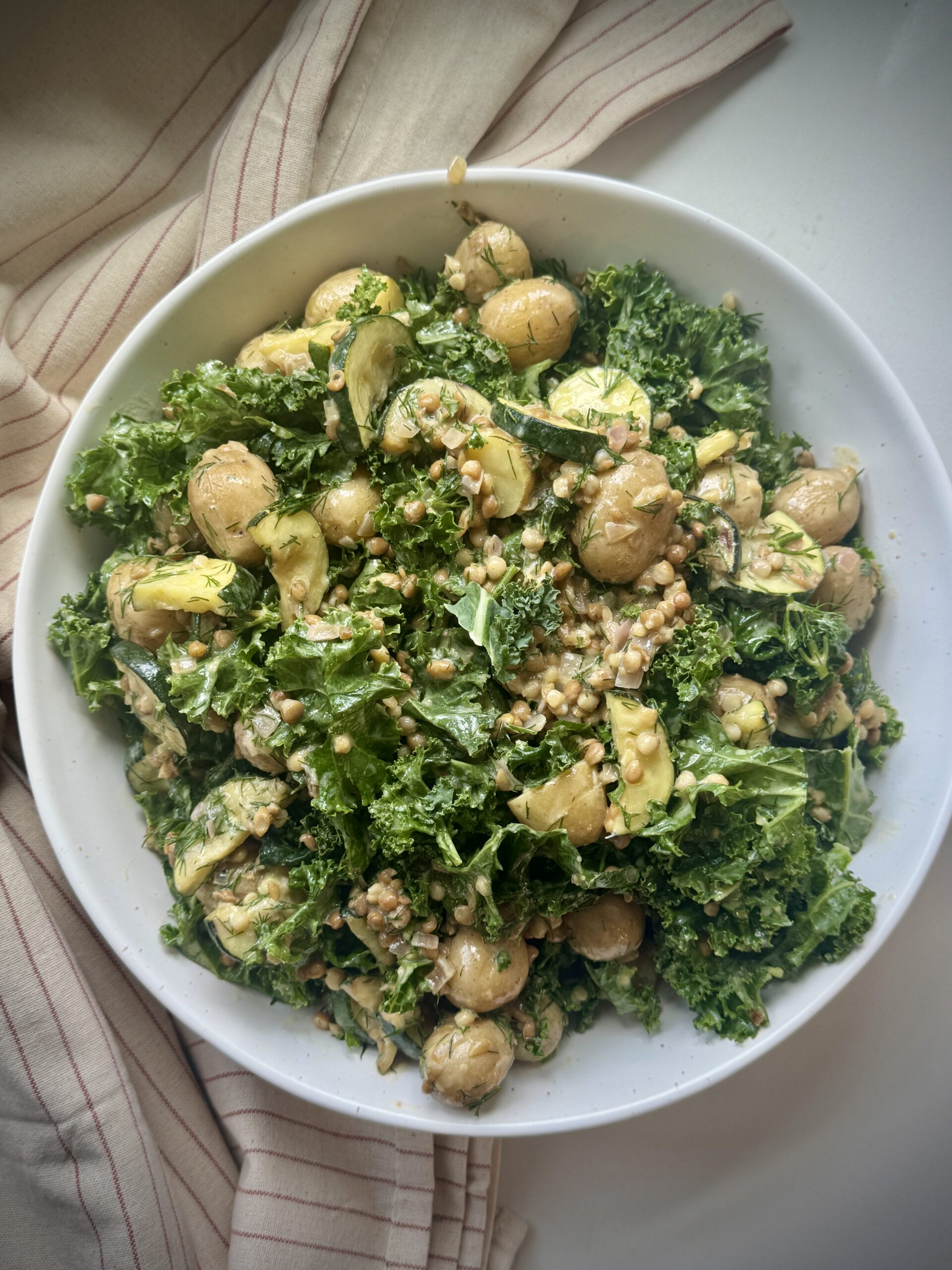 Potato and lentil salad recipe made with baby potatoes, lentils, kale, zucchini, fresh dill, and lemon Dijon dressing