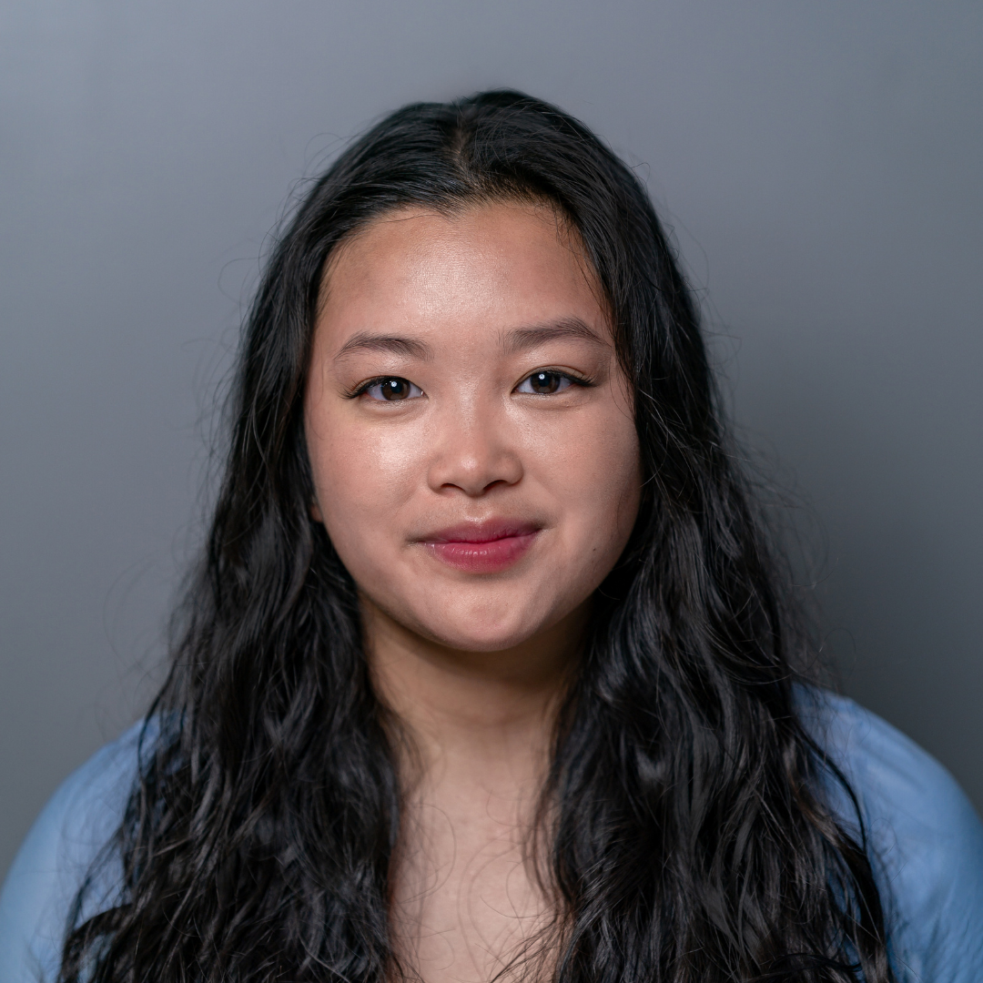 Graduation portrait of Leanne Langlois, Lupus Canada Scholarship Winner, with long dark hair and blue background.