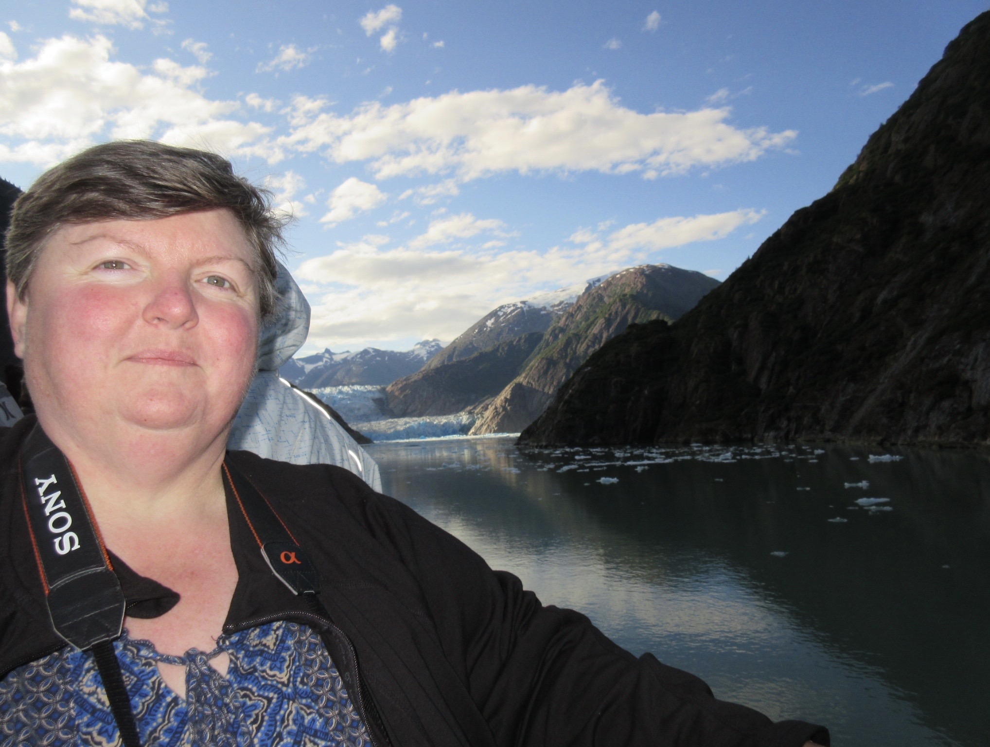 Maria with her camera while travelling and living with lupus