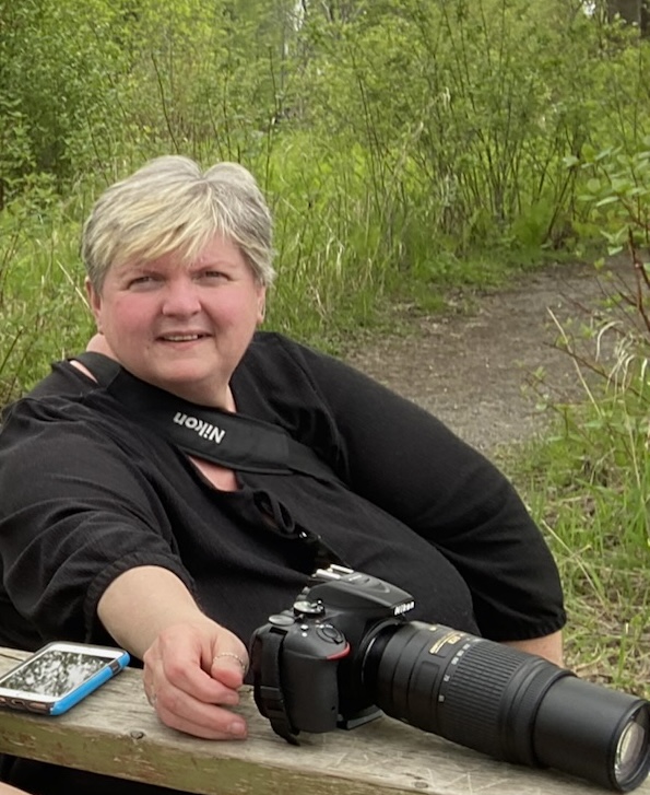 Maria outdoors with her camera while living with lupus